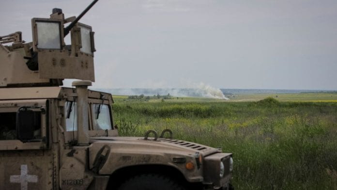 Ukrainian service members ride a military vehicle, amid Russia's attack on Ukraine, near the front line near the newly liberated village Neskuchne in Donetsk region, Ukraine on 13 June, 2023/Reuters
