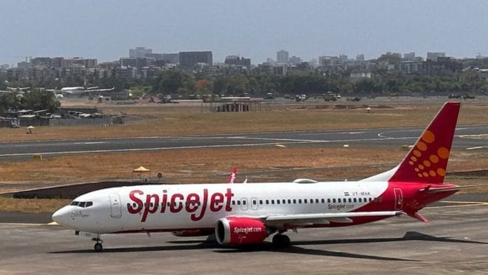 A SpiceJet passenger aircraft taxis on the tarmac at Chhatrapati Shivaji International Airport in Mumbai | Reuters