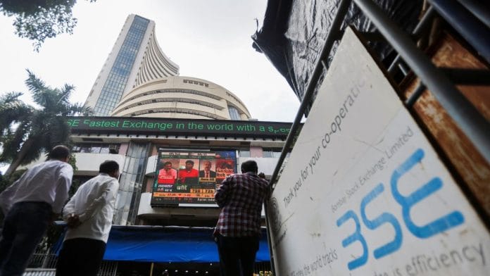 People stand outside the Bombay Stock Exchange (BSE), after Sensex surpassed the 60,000 level for the first time, in Mumbai, India | Reuters/Francis Mascarenhas