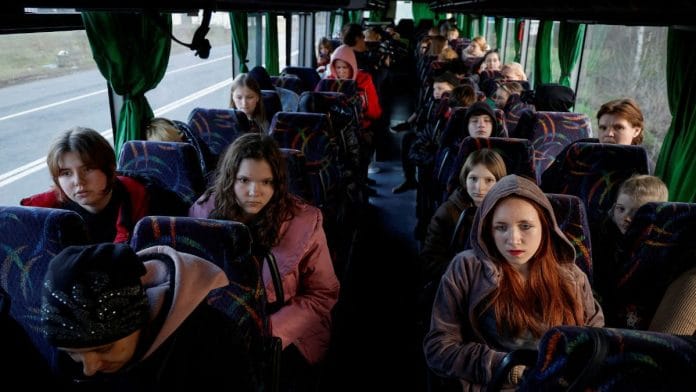 Children who went to a Russian-organised summer camp from non-government controlled territories and were then taken to Russia, wait for departure to Kyiv after returning via the Ukraine-Belarus border, in Volyn region, Ukraine | Reuters/Valentyn Ogirenko/File Photo