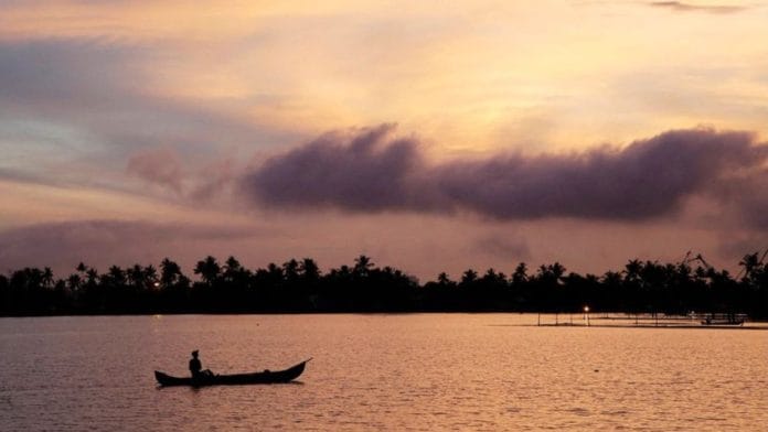 A man rows his boat in the tributary waters of Vembanad Lake against the backdrop of pre-monsoon clouds on the outskirts of Kochi, India, June 7, 2019. REUTERS/Sivaram V/File Photo