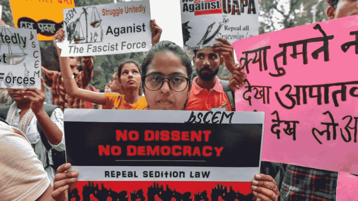File image of activists displaying placards during a protest in New Delhi | Photo: Kamal Kishore | PTI