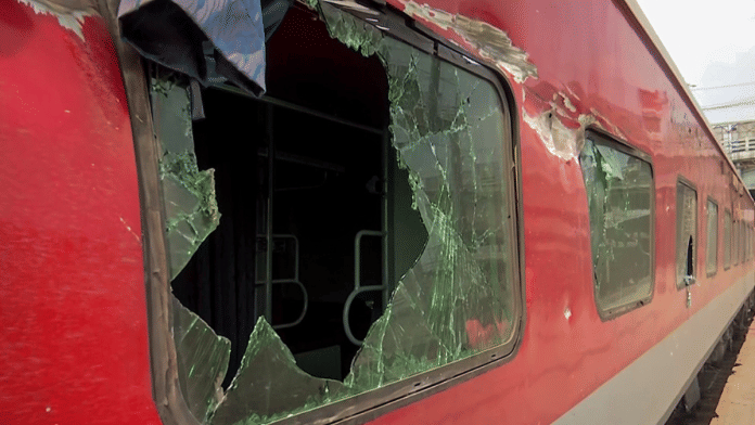 A shattered window panel of the Sir M.Visvesvaraya-Howrah Superfast Express at the Howrah Railway Station in West Bengal | ANI