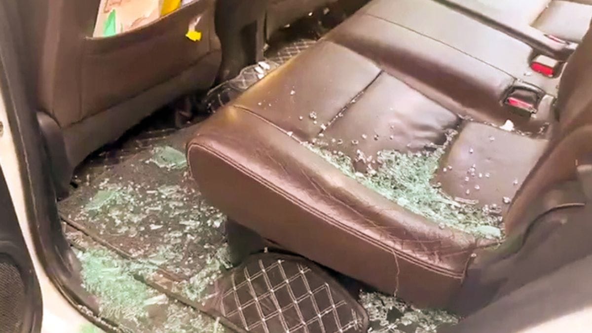 Shattered pieces of window are seen inside the convoy carrying Bhim Army chief Chandrashekhar Azad after he was allegedly shot by a few armed men in Saharanpur | Photo: ANI