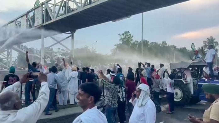 Water cannons being used to disperse farmers during a protest against demand for MSP for sunflower seeds at NH-44 in Kurukshetra's Shahabad Tuesday | Photo: ANI Photo