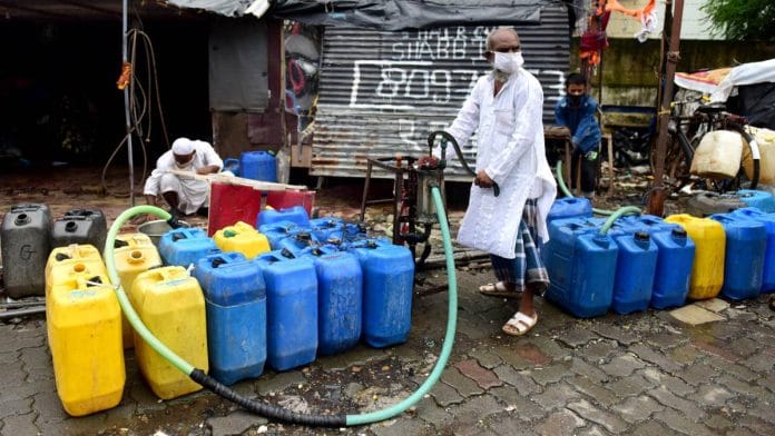 A local resident fills water at Ambuj Wadi, Malad in Mumbai | Representational image | ANI file photo