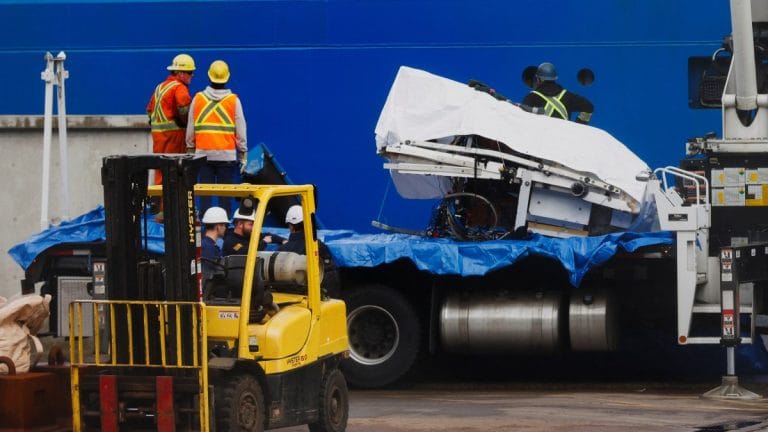‘Presumed human remains’ and shattered Titanic submersible returned to shore