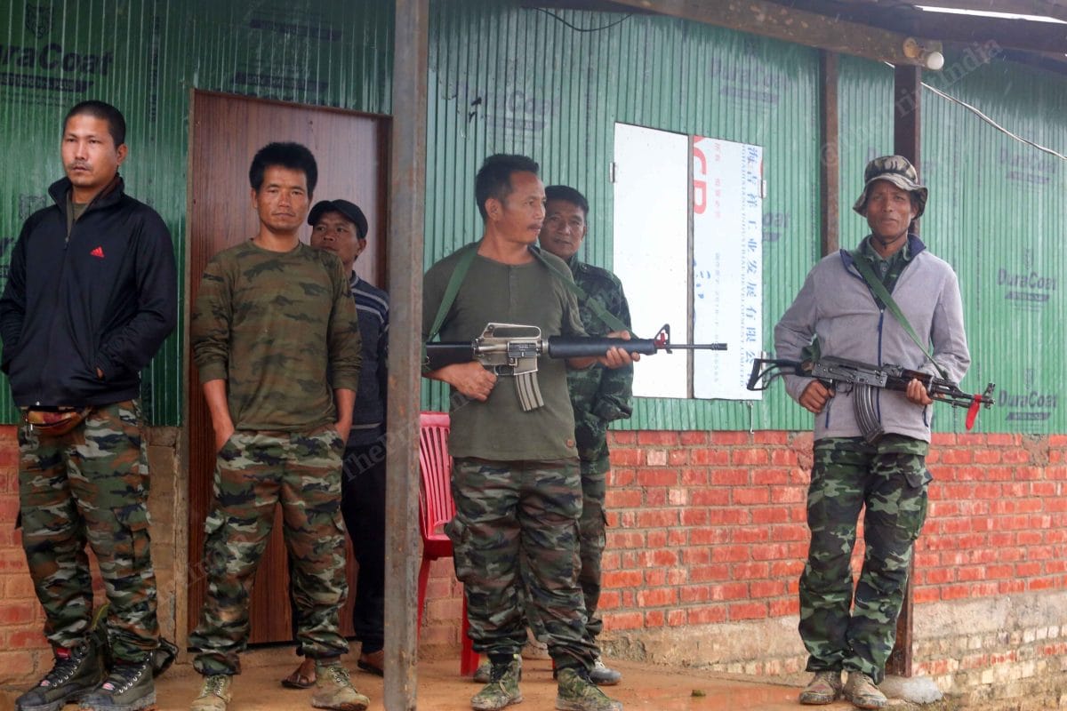 Cadres of Kuki insurgents keep an eye on the weapons at SoO Camp| Praveen Jain | ThePrint
