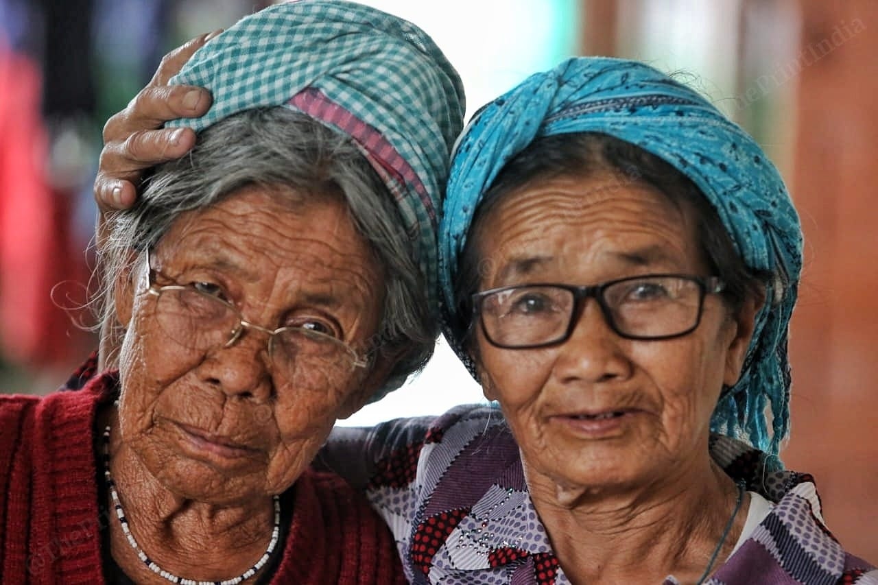 The old members of the families have also walked kilometres to save themselves from rioters. 81 years old Nemkholhing Gangte hugs her friend 82 years old Themkhonei Mate. They are thankful to god for saving them Photo: Praveen Jain | ThePrint