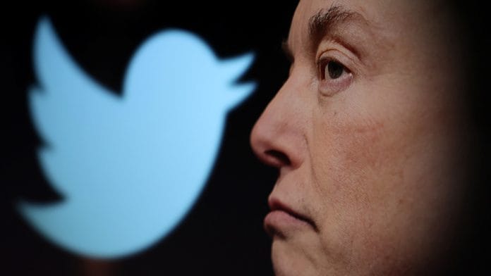 Twitter logo and a photo of Elon Musk are displayed through magnifier in this illustration | Reuters