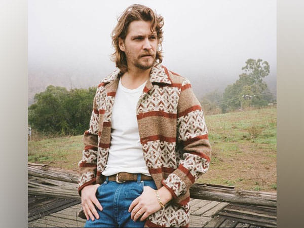 Luke Grimes says his wife learned English by watching 'The Office'