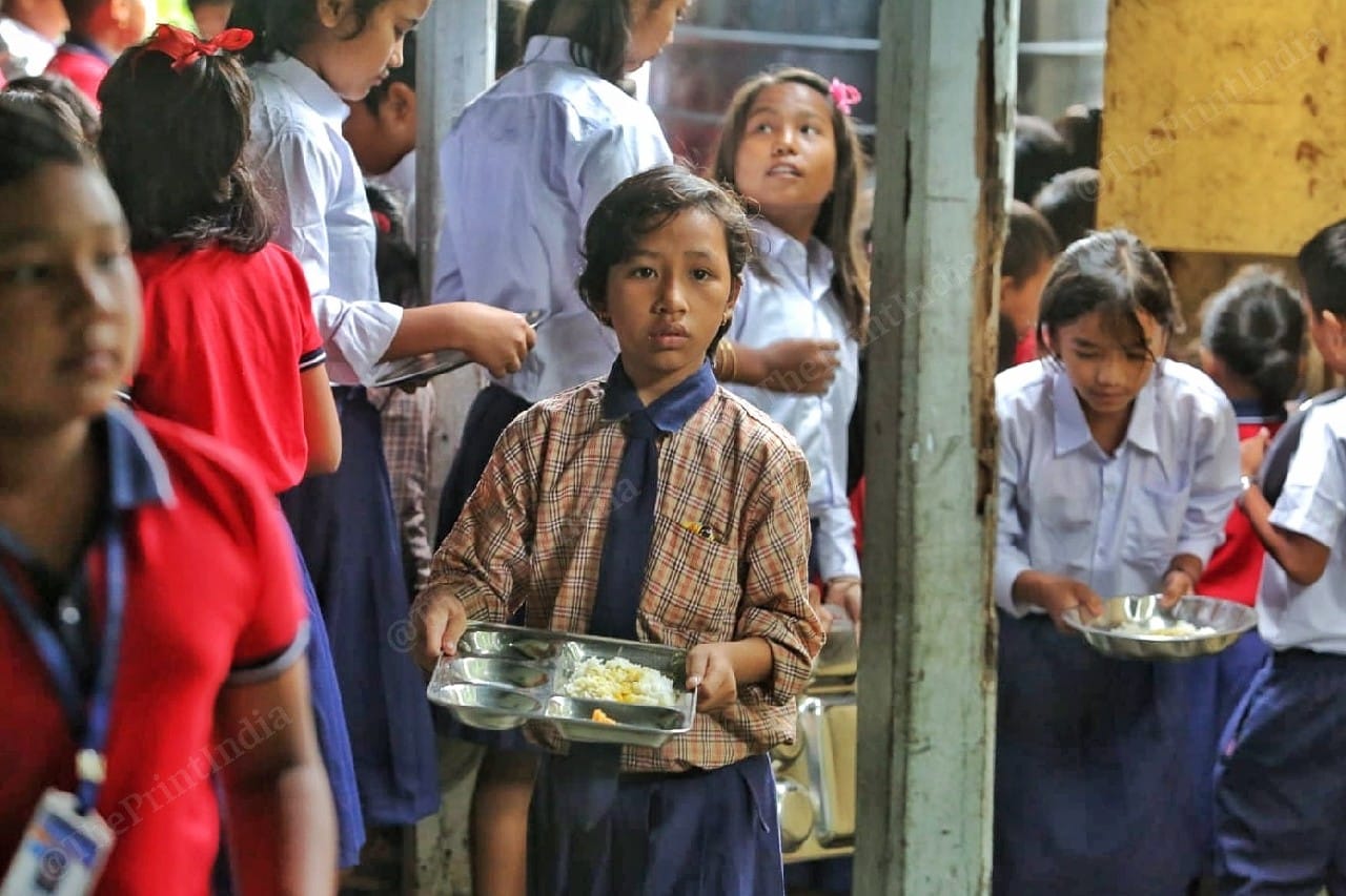 A girl walks out after taking her meal | Photo: Praveen Jain | ThePrint