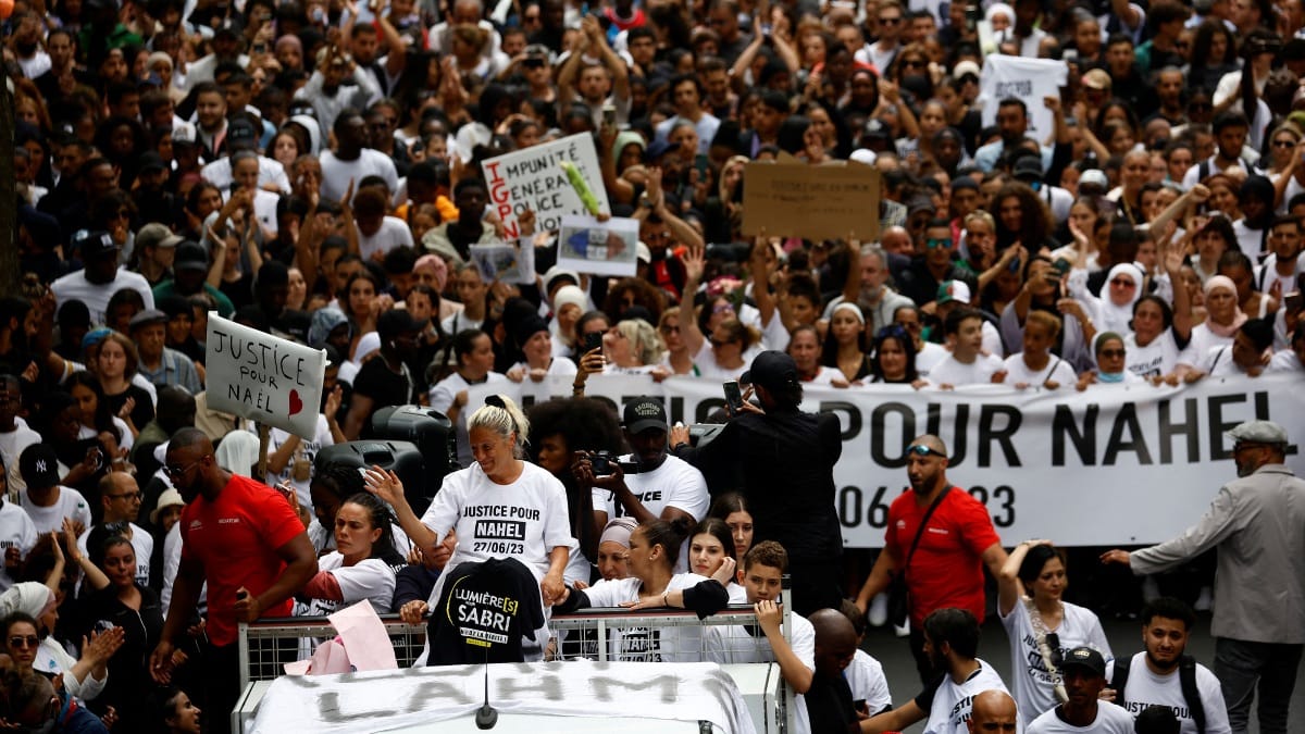 Nahel Merzouk's mother Mounia and relatives stand on a van as they attend a march in tribute to the 17-year-old in Nanterre, Paris suburb, France | Reuters