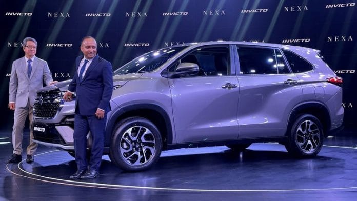Hisashi Takeuchi, MD & CEO of Maruti Suzuki India Ltd. and Shashank Srivastava, Senior Executive Officer, Marketing and Sales of Maruti Suzuki India Ltd., pose after the launch of multi-purpose vehicle Invicto in Gurugram, India, July 5, 2023 | Reuters