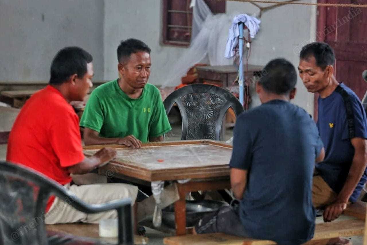 Members of the village defence committee play carrom | Praveen Jain | ThePrint