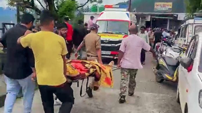 A person is being taken on a stretcher as he got injured after a transformer exploded on the banks of the Alaknanda River in the Chamoli district of Uttarakhand, on 19 July 2023 | ANI photo