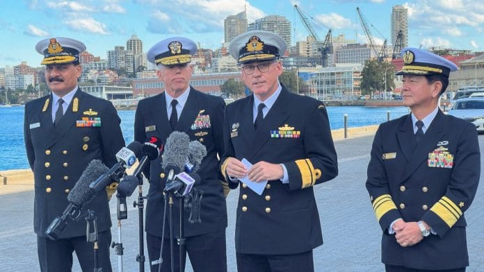 Vice admiral Saito Akira Commander in Chief of Japan Self Defense Fleet, Rear Admiral Christopher Smith, Commander Australian Fleet, Vice Admiral Dinesh Tripathi Commanding in Chief of India's Western Naval Command, and Vice Admiral Karl Thomas, Commander of the U.S. 7th Fleet speak with each other as India, Japan, US, Australia will hold first Malabar naval exercise off Australia, in Sydney, Australia | Reuters