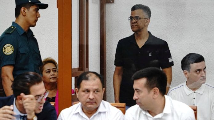Defendant Singh Raghvendra Pratar, an executive of Quramax Medical, a company that sold medicines produced by India's Marion Biotech in Uzbekistan, stands inside an enclosure for defendants during a court hearing in the case of child deaths linked to contaminated cough syrups, in Tashkent, Uzbekistan | Reuters