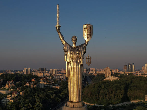 Kyiv takes down Soviet-era signs, replaces hammer-and-sickle symbol with trident coat of arms