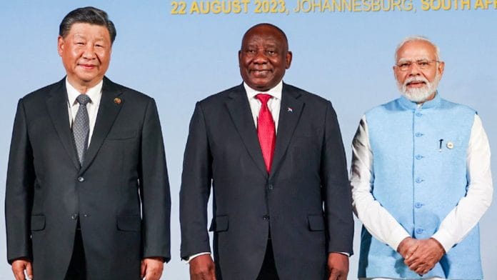 PM Narendra Modi poses for a photograph with South African President Cyril Ramaphosa and Chinese President Xi Jinping during the 15th BRICS Summit | ANI