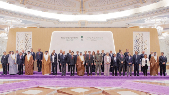 Representatives from more than 40 countries including China, India, and the U.S., pose for a family picture as they attend talks in Jeddah, Saudi Arabia, August 6, 2023, to make a headway towards a peaceful end to Russia's war in Ukraine. Saudi Press Agency/Handout via REUTERS