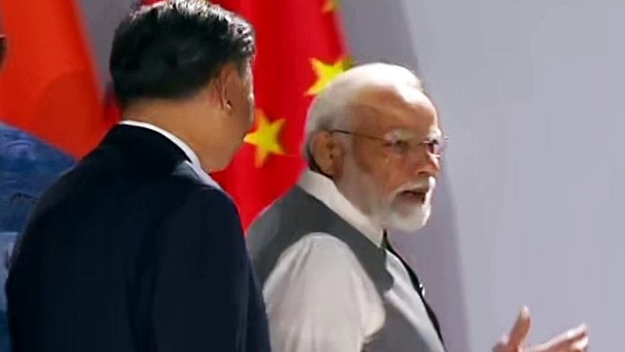 Prime Minister Narendra Modi and Chinese President Xi Jinping engage in a brief interaction at the 15th BRICS Summit, in Johannesburg on Thursday | ANI