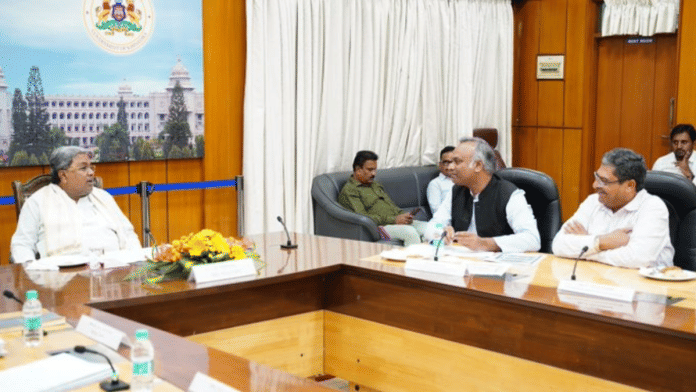 Karnataka CM Siddaramaiah with his minister Priyank Kharge at a meeting | Twitter | @CMofKarnataka