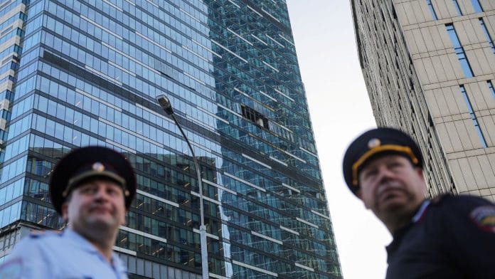Emergency personnel work near a damaged office building in the Moscow City following a reported Ukrainian drone attack in Moscow Russia, August 1, 2023 | Reuters
