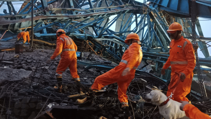 NRF personnel carry out a search and rescue operation after a crane fell on on the under construction Samruddhi Expressway at Shahapur tehsil in Thane district | PTI photo