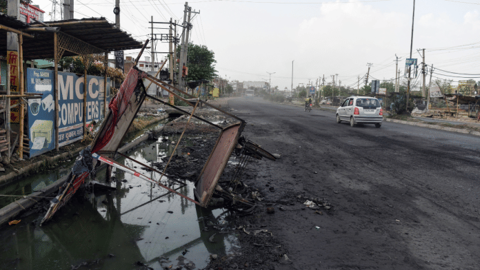 A damaged hand cart after the violent clash between two groups, in Nuh District, Haryana on Thursday | ANI/Ishant