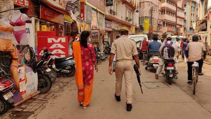 Petitioner Rakhi Singh on the way to Gyanvapi mosque to observe the ASI survey team. She has been provided security since she filed a case demanding praying rights inside the Gyanvapi mosque complex | Sonal Matharu, ThePrint