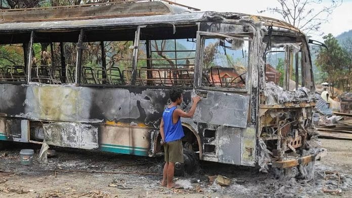 A public transport bus that was set ablaze in the violence | Photo: Suraj Singh Bisht | ThePrint