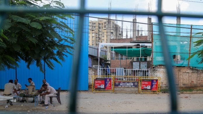 Policemen posted outside Anjuman Jama Masjid, which was set on fire, at Gurugram's Sector 57 | Suraj Singh Bisht | ThePrint