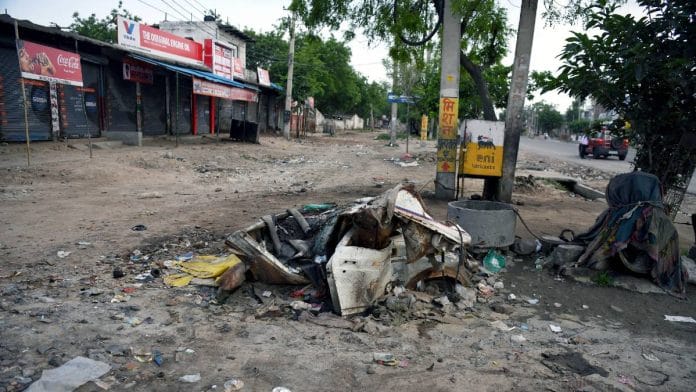 File photo: A part of a charred vehicle following the violence in Nuh