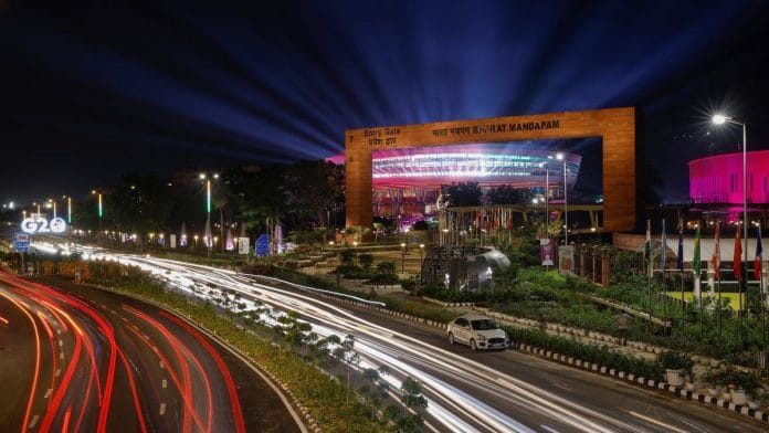 Traffic moves past the 'Bharat Mandapam', the main venue of the G20 Summit in New Delhi, India | Reuters