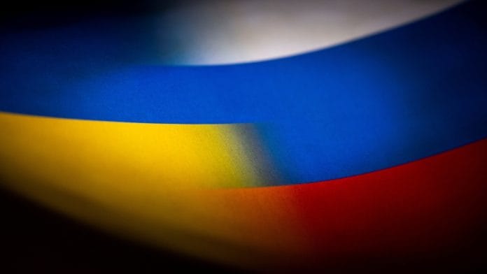 Russia's and Ukraine's flags are seen printed on paper in this illustration | Reuters File Photo