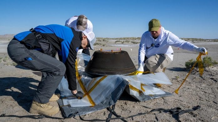 The return capsule containing a sample collected from the asteroid Bennu in October 2020 by NASA’s OSIRIS-REx spacecraft is seen shortly after touching down in the desert at the Department of Defense's Utah Test and Training Range in Dugway, Utah, U.S. September 24, 2023. NASA/Keegan Barber/Handout via REUTERS
