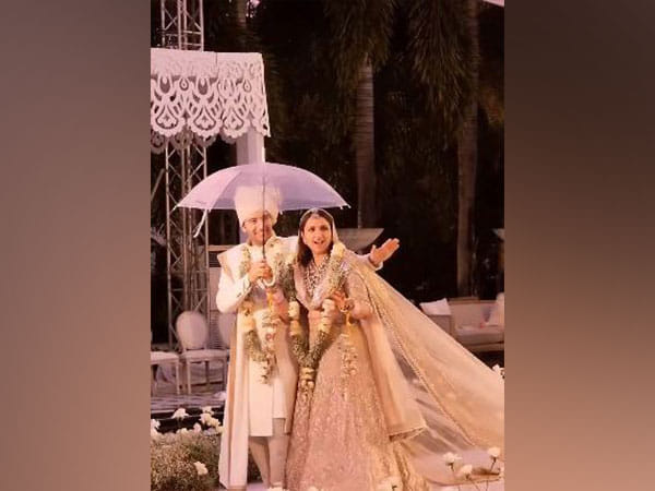 Parineeti Chopra, Raghav Chadha groove under umbrella as they walk down aisle