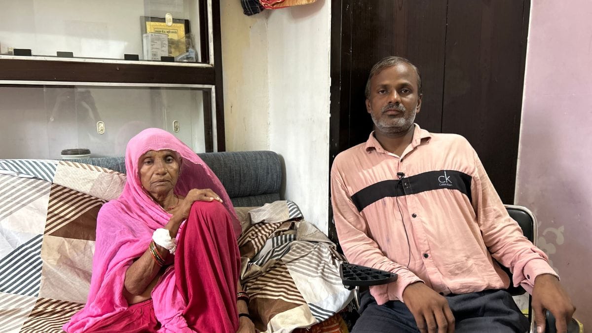 Bhanwari Devi with her younger son, Mukesh, who lives with her. She has been deeply affected by the family dispute over the land the government gave her as compensation. | Photo: Jyoti Yadav | ThePrint