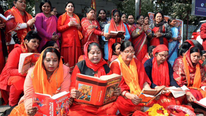 Bharatiya Janata Party supporters read Ramcharitmanas outside Shiv Parwati Hanuman Temple during a protest against Bihar Education minister Chandra Shekhar over his alleged comments on Ramcharitmanas in Patna on Tuesday | ANI