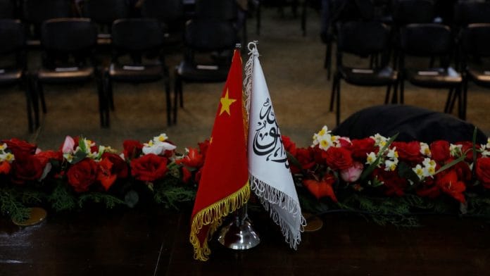The flags of the China and the Islamic Emirate of Afghanistan are displayed during a news conference held in Kabul | Reuters