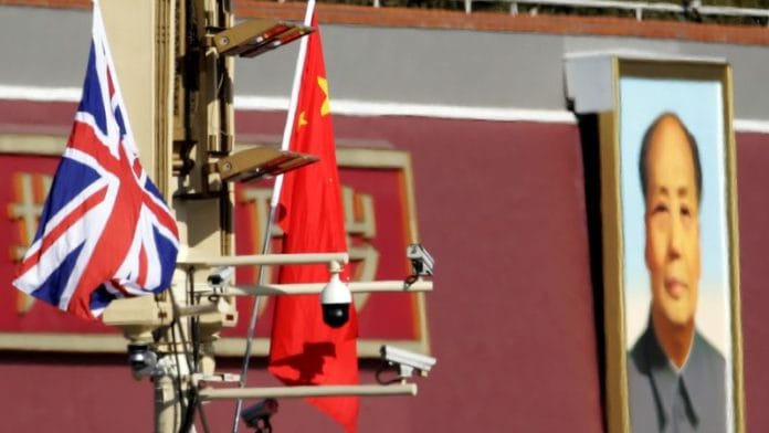 A Union flag and a Chinese flag are placed at a pole with security cameras in front of a portrait of late Chinese Chairman Mao Zedong at the Tiananmen gate in Beijing | Reuters file photo