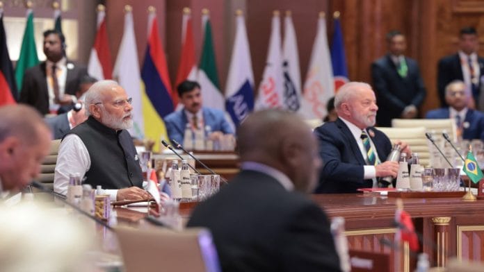 PM Narendra Modi with fellow world leaders at a G20 session at the Bharat Mandapam in New Delhi Saturday | X/@NarendraModi