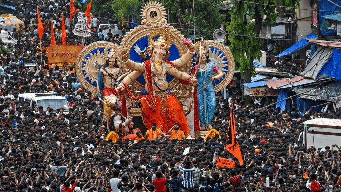 Devotees carry the idol of Lord Ganesha to be installed at a pandal ahead of the Ganesh Chaturthi festival in Mumbai | ANI