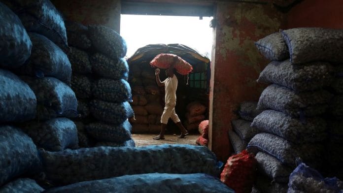 A worker carries a sack of potatoes at a wholesale market in Mumbai, India July 14, 2017 | Reuters