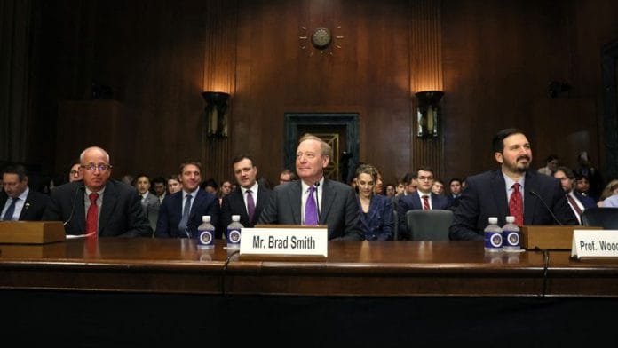 Microsoft President Brad Smith, Nvidia's chief scientist William Dally, and Professor Woodrow Hartzog wait to testify before a Senate Judiciary Privacy, Technology, and the Law Subcommittee hearing on 