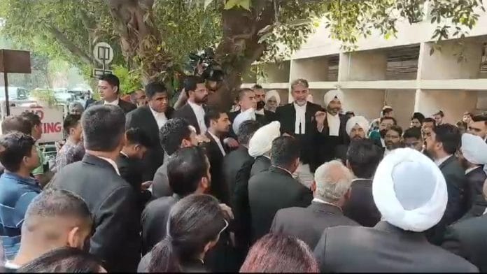 Advocates of Punjab & Haryana HC staging protest in the court premises, Monday | By special arrangement