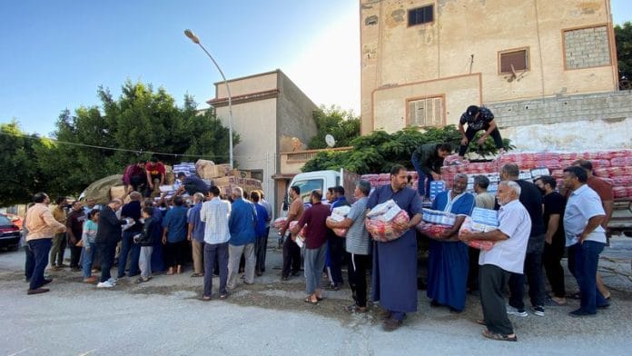 Displaced people receive food aid from private schools and parents from east of Libya, in the aftermath of the floods in Derna, Libya, on 15 September 2023 | Reuters