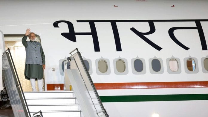 Modi on the Air India One ahead of his trip to Jakarta. | ANI