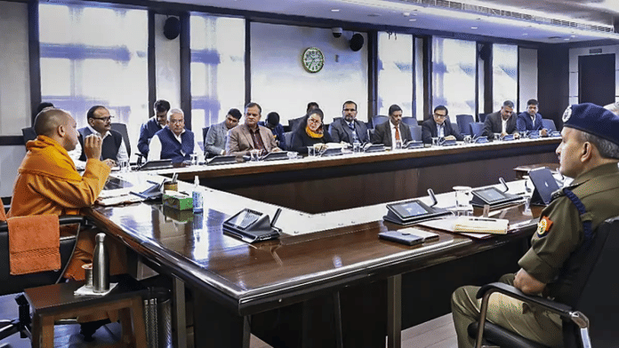 File photo of Uttar Pradesh CM Yogi Adityanath at a meeting with senior civil service and police officers | PTI